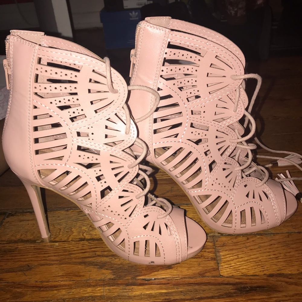 Woman’s pink lace up heel